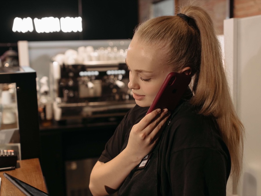 Restaurant team member taking a phone order at the counter